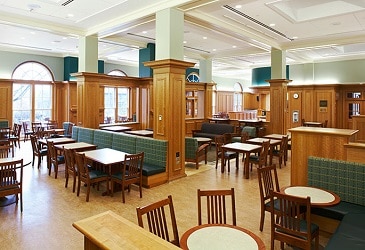 stacking wooden boarding school chairs